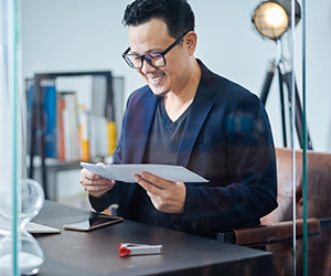 man filling a letter