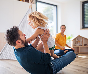 father wrestling with child