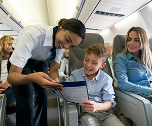 woman talking to child on a plane
